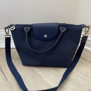 Longchamp Modele Depose Navy Shoulder Bag
Folding packable tote purse luggage